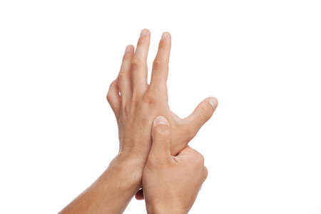 Unrecognizable young caucasian man suffer from pain in arm and pressing hand to sore spot