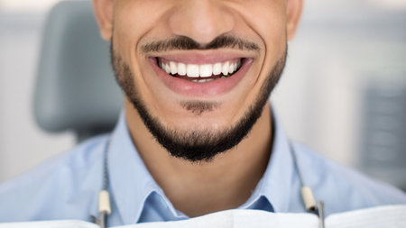 Dental Treatment Result. Happy Young Arab Man Smiling With Perfect Teeth, Closeupの写真素材