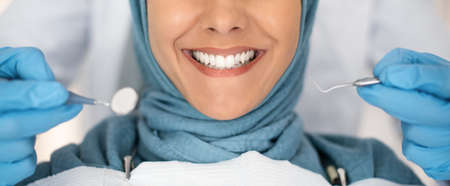 Dental Check Up. Smiling Muslim Lady Getting Treatment In Stomatologic Clinic, Closeupの写真素材
