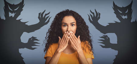 Inner Fears And Phobias. Woman Scared By Drawn Shadow Monsters Around Herの写真素材