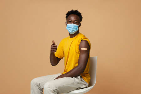 Vaccination Advertisement. Vaccinated Black Guy With Plaster On Arm Showing Thumb Upの写真素材