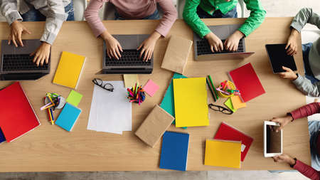 Top-View Of School Kids Using Laptop Computers Sitting Indoor, Panoramaの写真素材