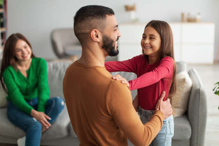 Arab girl celebrating fathers day, greeting dadの写真素材