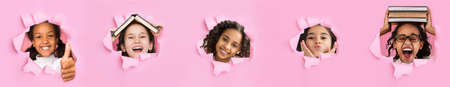 Happy funny teenager asian, black and arabian girls pupil look through hole in pink paper, panoramaの写真素材