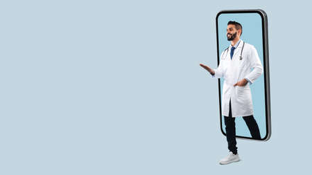 Doctor coming out big smartphone screen, panoramaの写真素材
