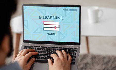 E-Learning Concept. Over Shoulder View Of Man Using Laptop For Online Educationの写真素材