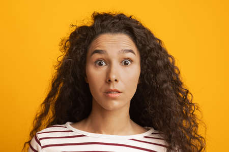 Human Emotions. Portrait Of Dazed Young Woman Looking At Camera With Shockの写真素材