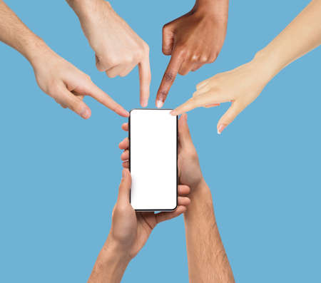Male hands holding smartphone, people pointing at screenの写真素材