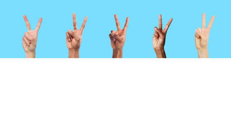 Closeup of male and female hands showing ok sign gestureの写真素材