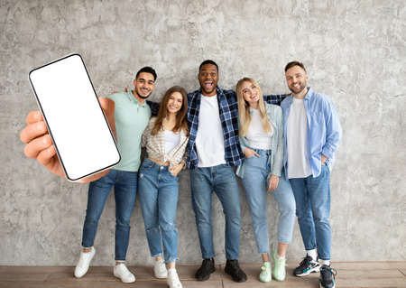 Diverse people showing white empty smartphone screen in hand