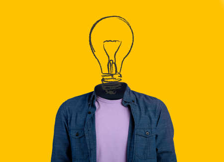 Collage with unrecognizable man wigth drawing of light bulb in place of head on orange background. Creativity conceptの写真素材