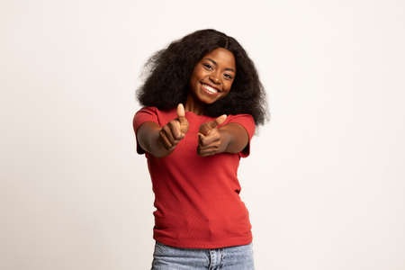 Happy Emotion. Cheerful Black Millennial Woman Gesturing Thumbs Up At Cameraの写真素材