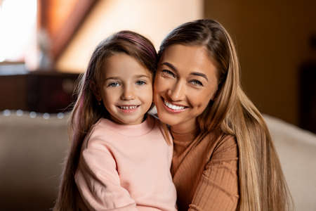 Portrait of happy woman and daughter spending time togetherの写真素材