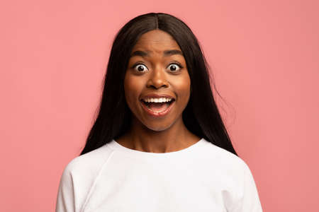 Surprised black lady looking at camera, closeup shot