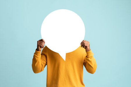 Black man hiding behind empty communication chartの写真素材