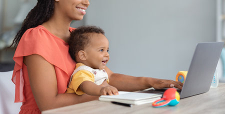Kids And Technologies. Black Baby Boy Using Laptop With Mom At Homeの写真素材