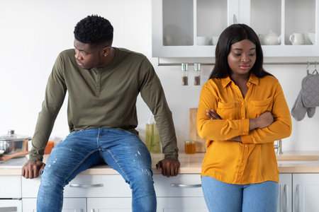 Relationship Crisis. Portrait Of Offended Black Couple Standing In Kitchen After Argueの写真素材