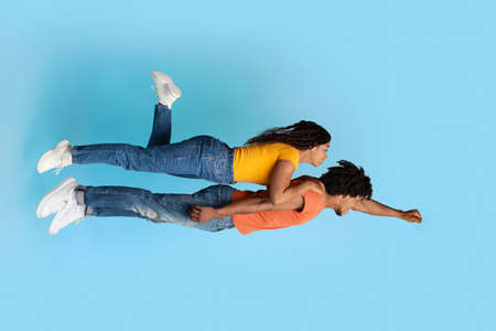 Romantic african american couple flying together in the air