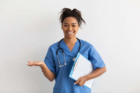 Portrait of black doctor smiling and posing to camera