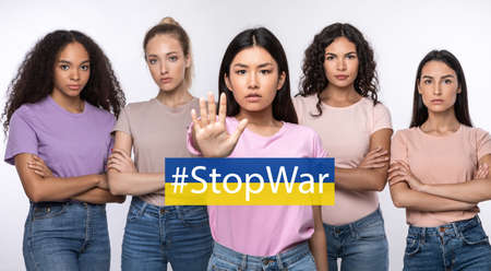 Stop War. Angry Multiethnic Ladies Gesturing Stop Signの写真素材