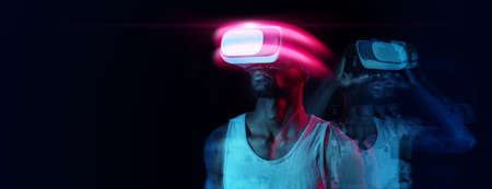 Creative collage in neon colors of fit african american man in VR headset, standing over dark...