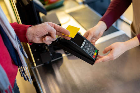 Cropped of male customer paying with credit card