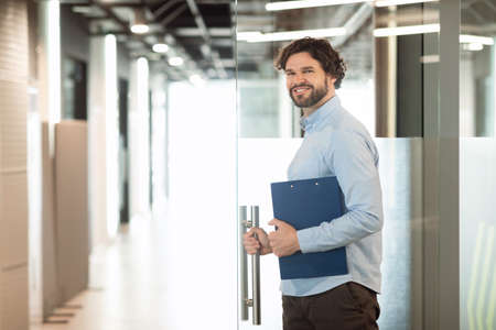 Portrait of smiling business man posing looking at cameraの写真素材
