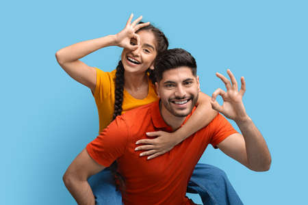 Great Choice. Cheerful Arab Couple Gesturing Ok And Having Fun Togetherの写真素材