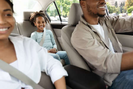 Cheerful Black Family Riding New Car Travelling By Auto, Cropped