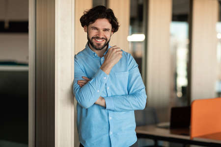 Portrait of confident business man posing looking at cameraの写真素材