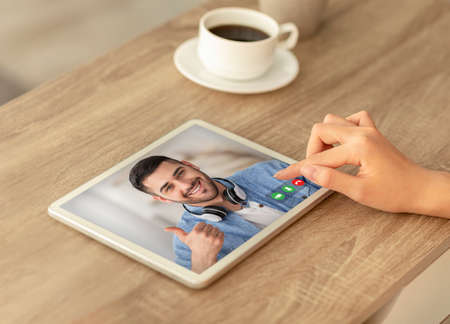 Unrecognizable Woman Sitting In Cafe With Digital Tablet And Making Video Call
