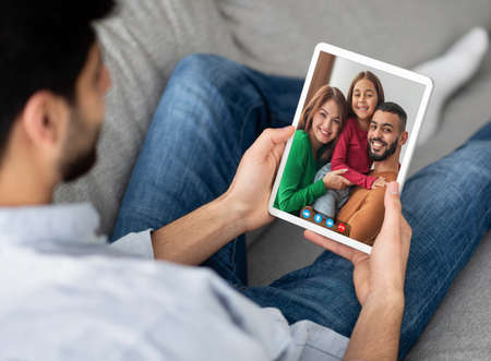 Video Call. Young Man Making Web Conference With Friends On Digital Tablet
