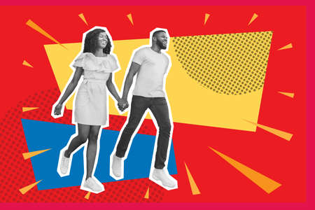 Happy black couple running towards copy space over colorful backgroundの写真素材