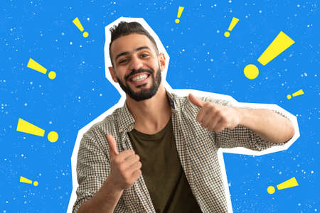 Cheerful young middle eastern man showing thumb upsの写真素材