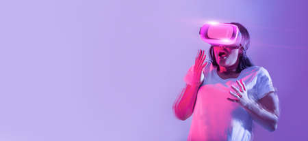 Getting to know digital world. Frightened woman in virtual glasses