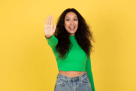 Excited Middle Eastern Lady Gesturing Stop Standing Over Yellow Background
