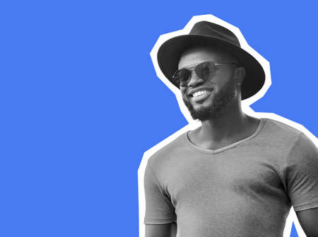 Hot african american man looking at copy space and smilingの写真素材