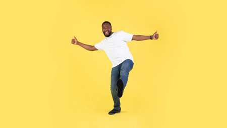 African American Guy Gesturing Thumbs Up Over Yellow Background, Panorama