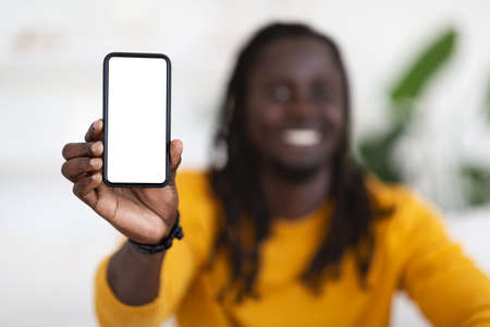 Great App. Smiling Black Guy Showing Blank Smartphone With White Screen