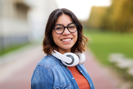 Portrait Of Young Arab Student Female In Stylish Eyeglasses Standing Outdoorsの写真素材