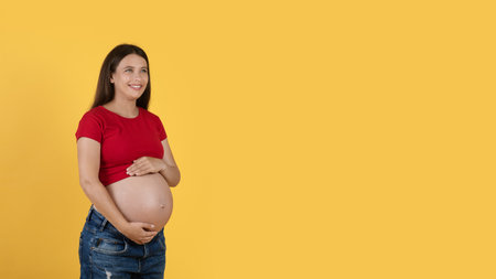 Pregnancy Offer. Beautiful Woman Embracing Her Pregnant Belly And Looking Away