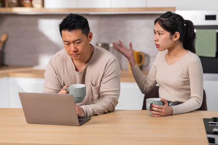 Furious japanese woman shouting at her husbandの写真素材