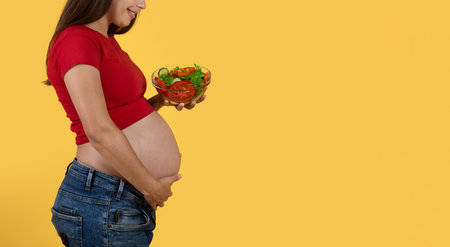 Healthy Eating. Side View Of Pregnant Woman Holding Bowl With Vegetable Salad