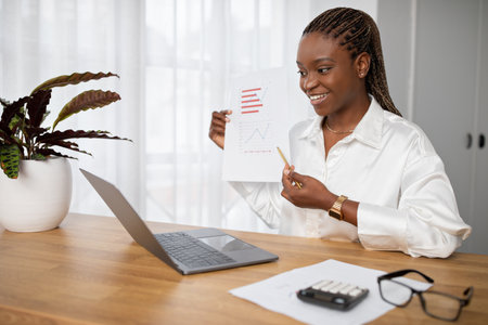 Cheerful young black woman have online business meeting