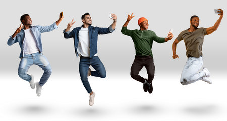Group Of Males Taking Selfie On Smartphone While Jumping Over White Background