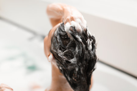 Closeup Of Female Head With Shampoo Applied On Hair Indoorの写真素材