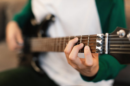 Unrecognizable Guy Playing Electric Guitar Indoors, Closeup Of Handsの写真素材