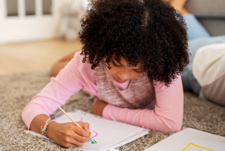 Black Girl Drawing With Watercolor Paint And Brush At Homeの写真素材