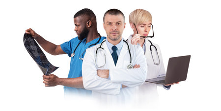 Multiethnic Team Of Doctors Posing In Uniform Isolated Over White Backgroundの写真素材