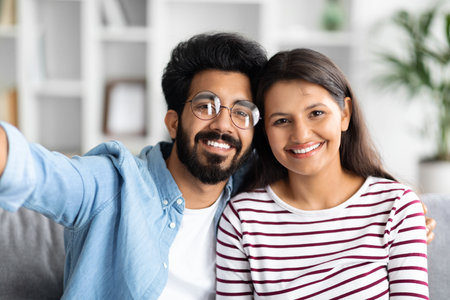 Portrait of loving happy beautiful mixed race couple, home interiorの写真素材